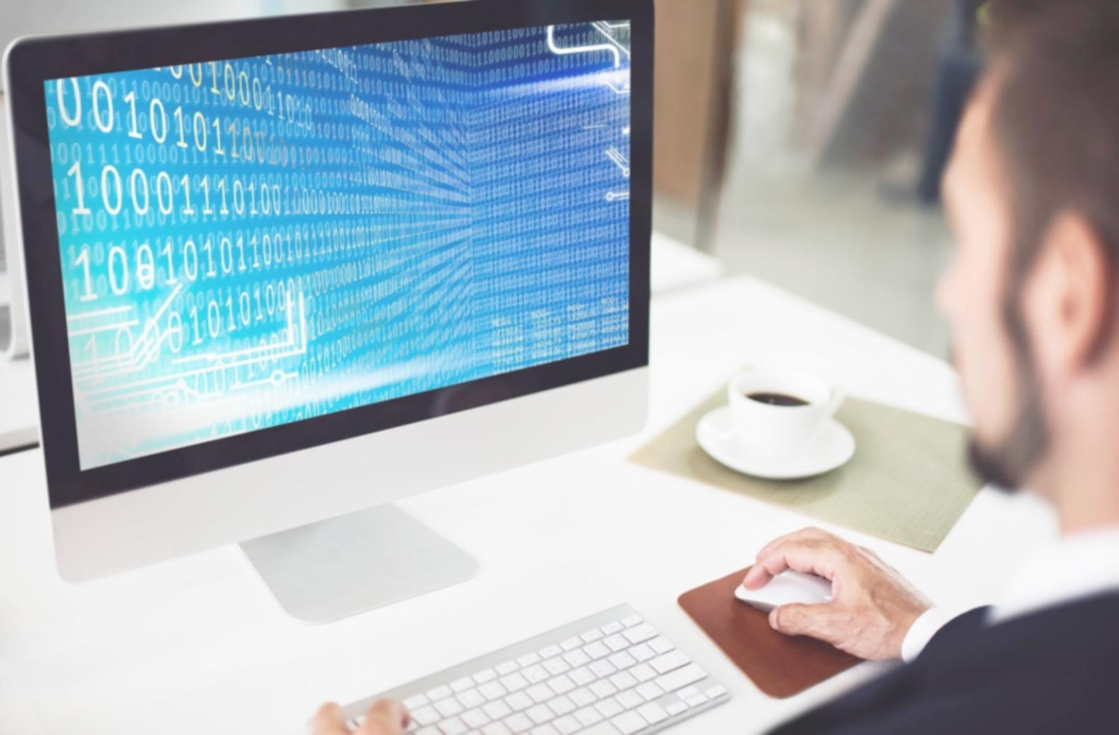 Modern programming workspace with multiple monitors and development tools