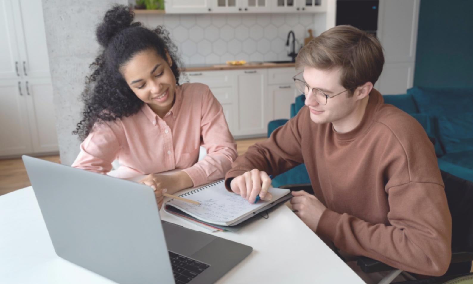 Programming workspace showing multiple monitors with code editor, development tools, and learning resources displayed